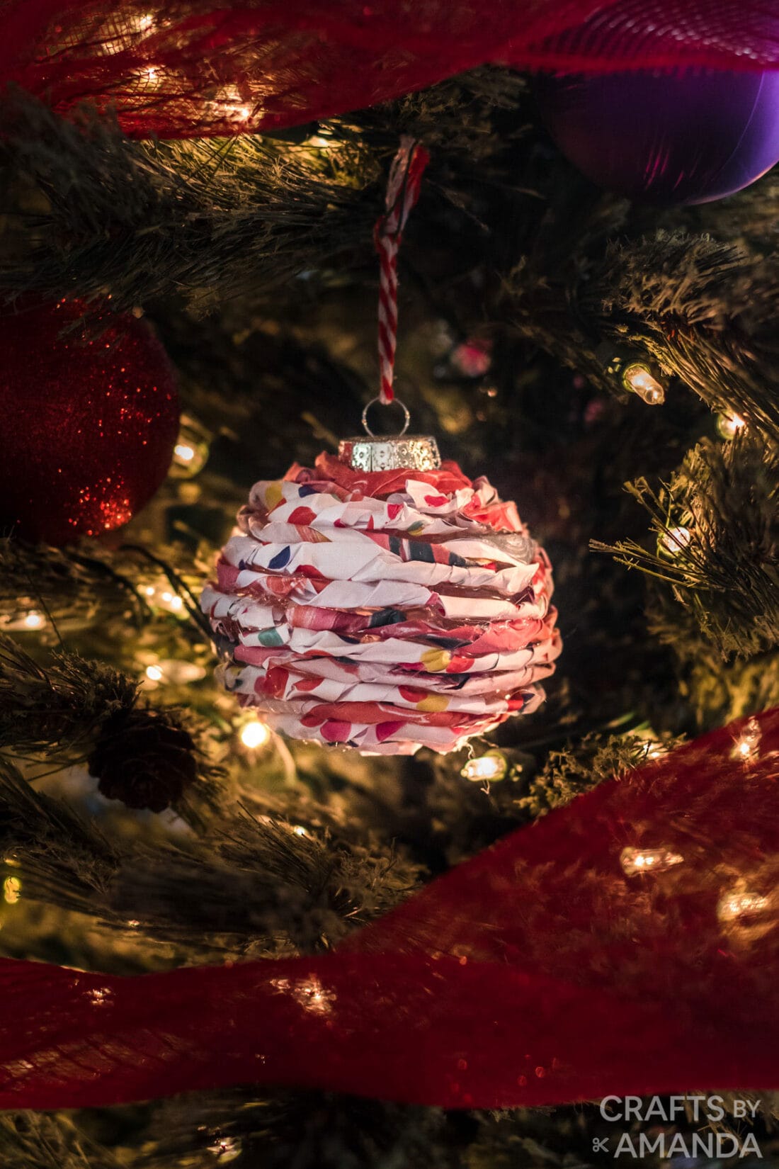 twisted paper ornament in a christmas tree