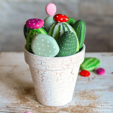 cactus painted rocks in a clay pot