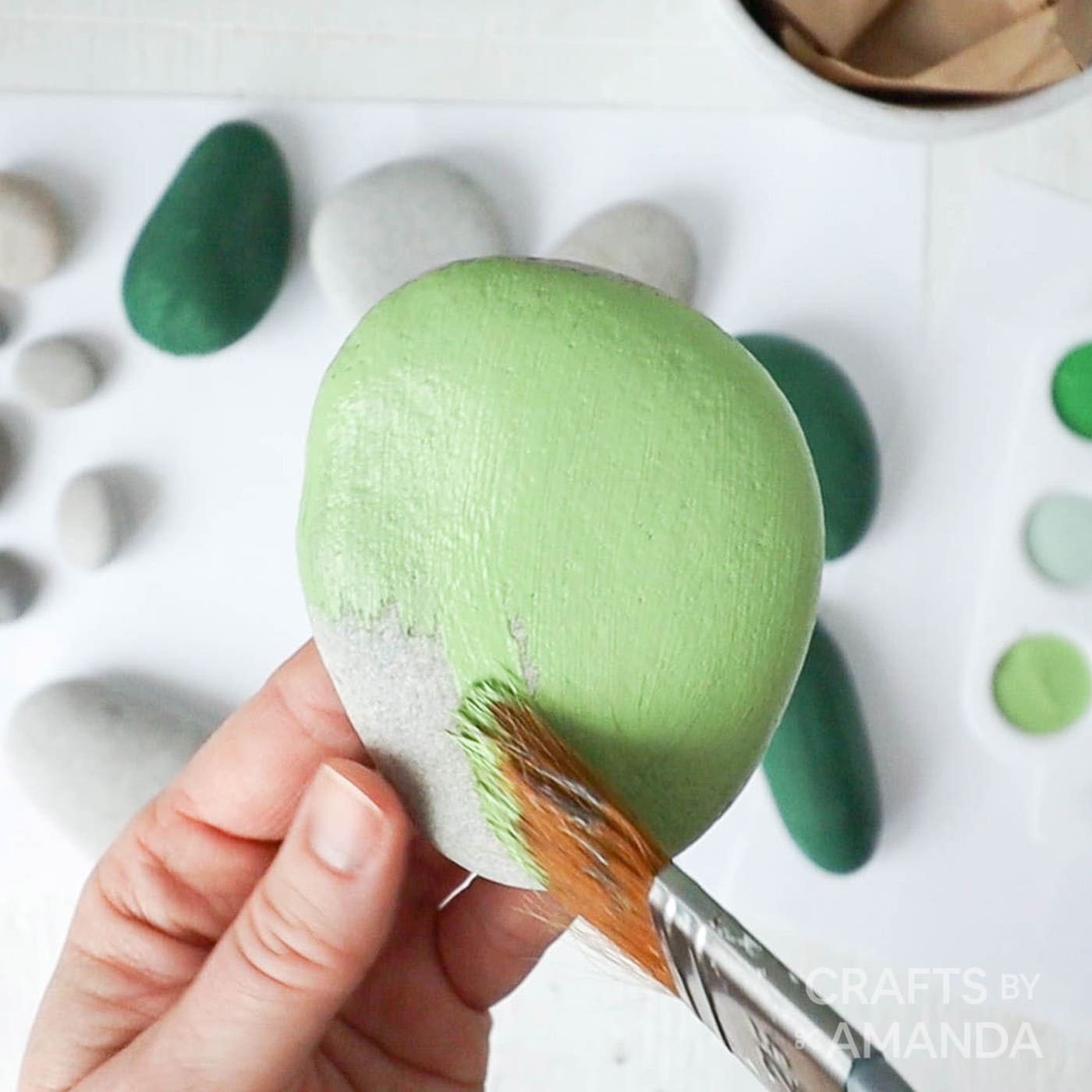 painting a rock green