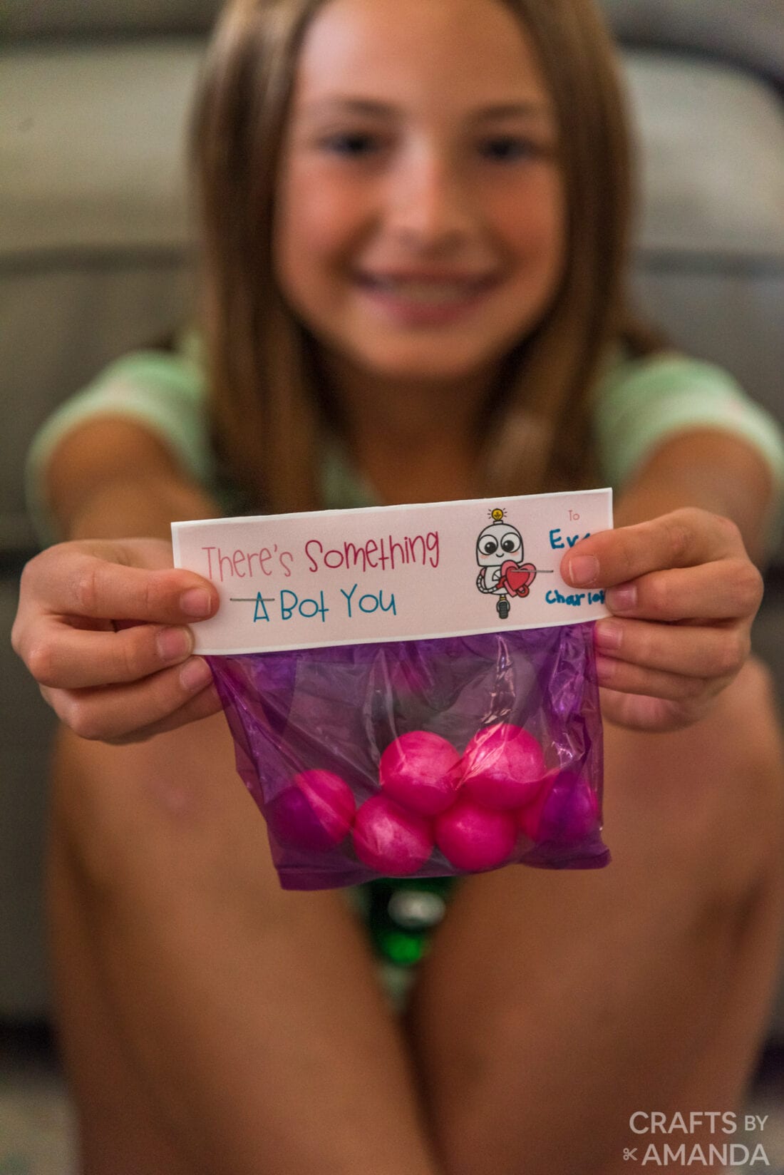 girl holding a bag of valentine candy