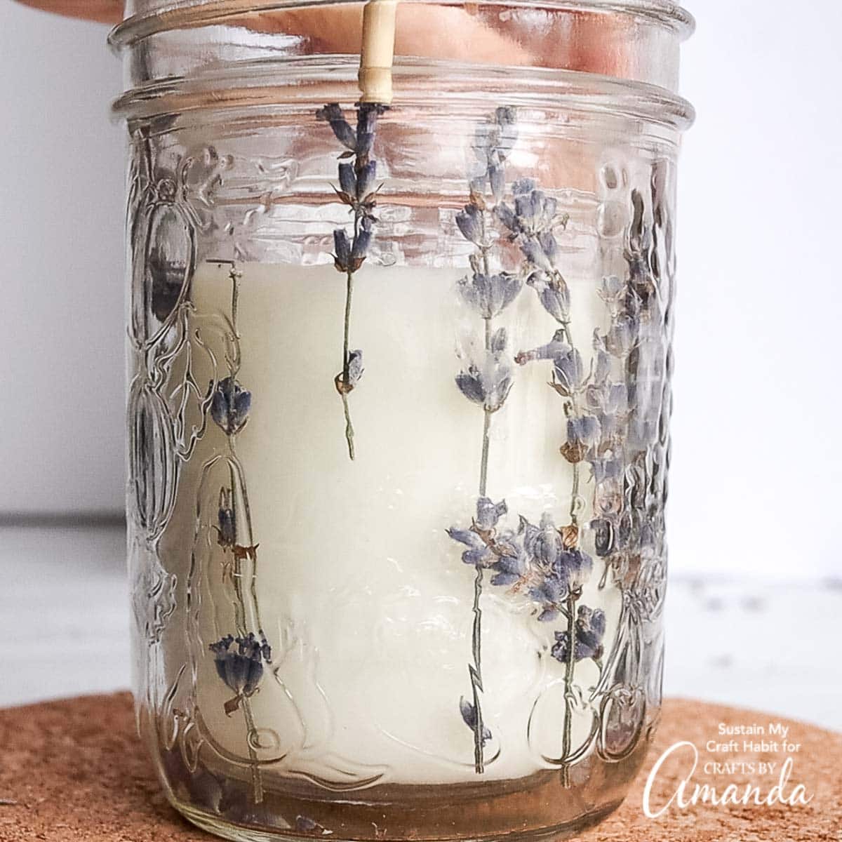 adding lavender to candle jar