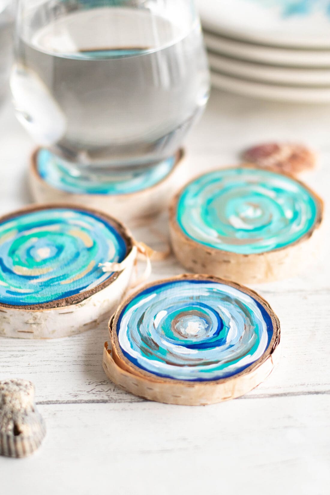 Coastal Wood Slice Coasters with a glass of water
