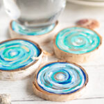 Coastal Wood Slice Coasters with a glass of water