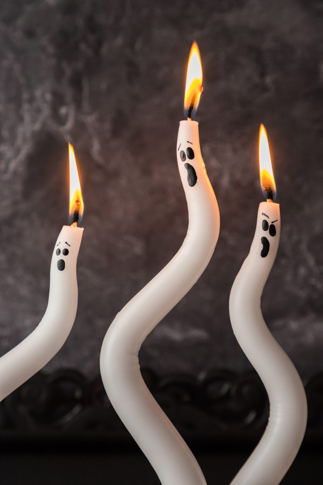 Close up photo of lit Ghost Candles