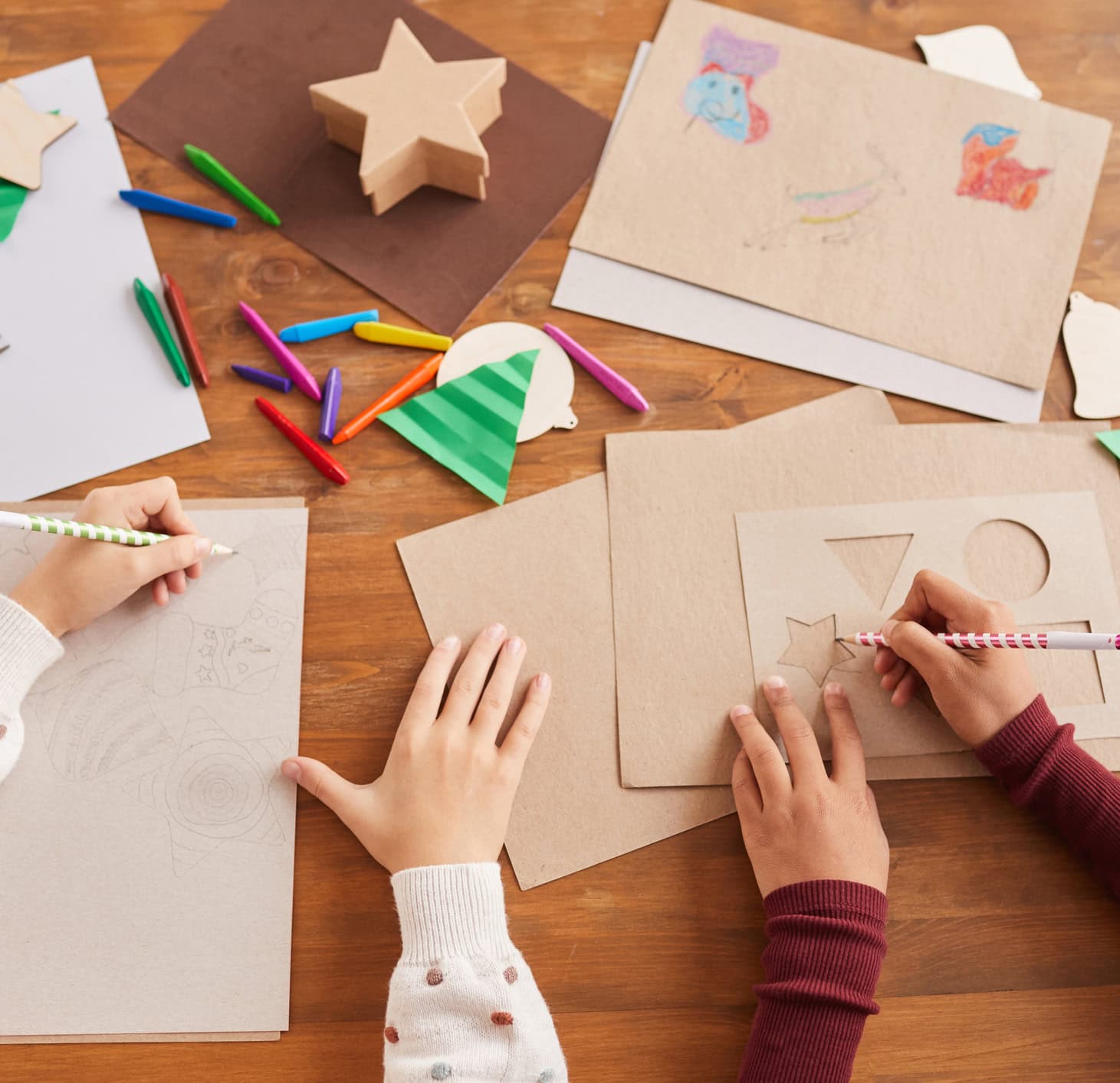 Top view close up of children drawing pictures during art and craft class in school, copy space