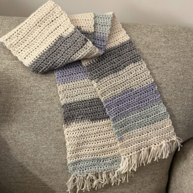 crocheted scarf on a chair