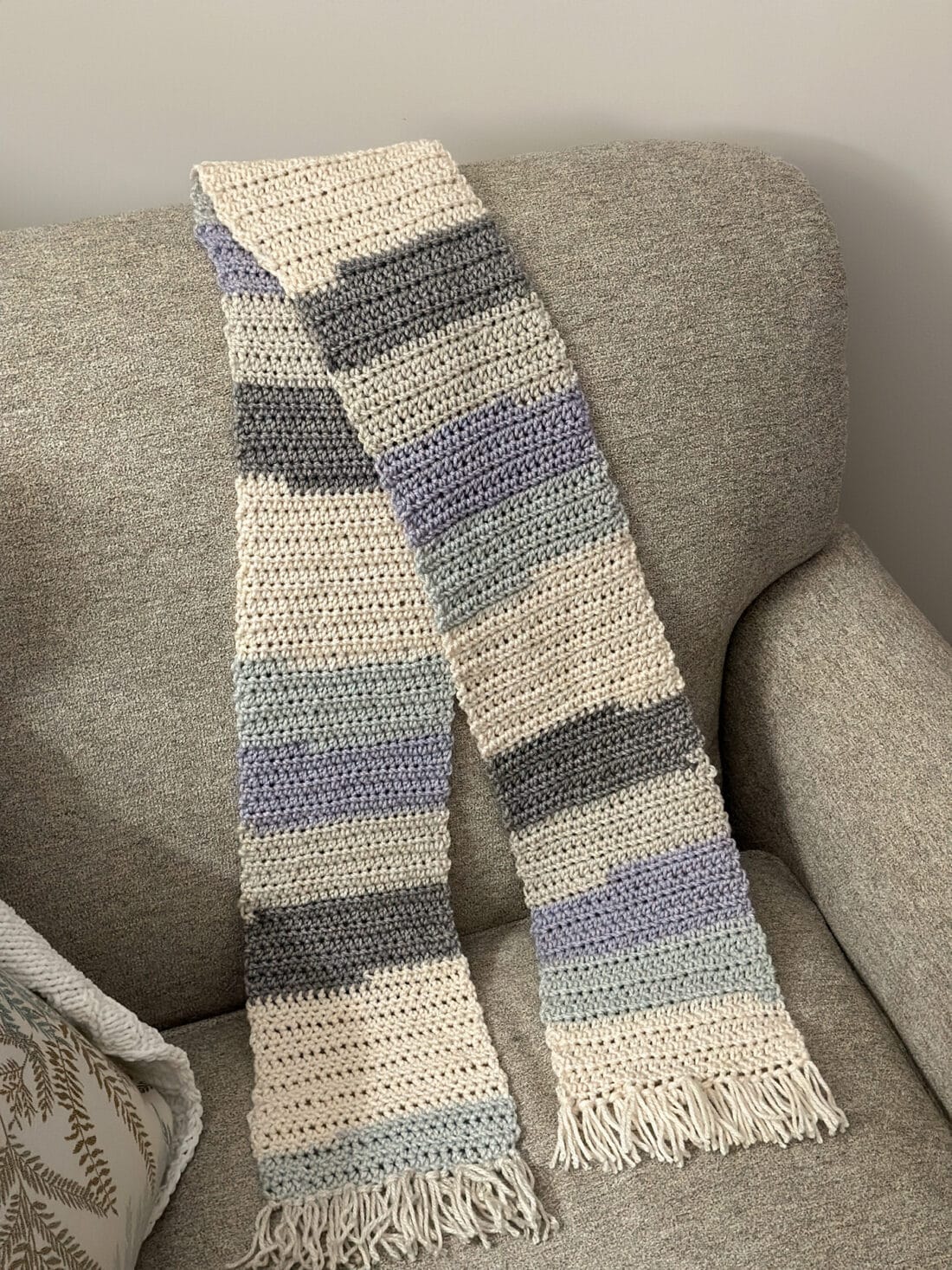 crocheted scarf draped over a chair