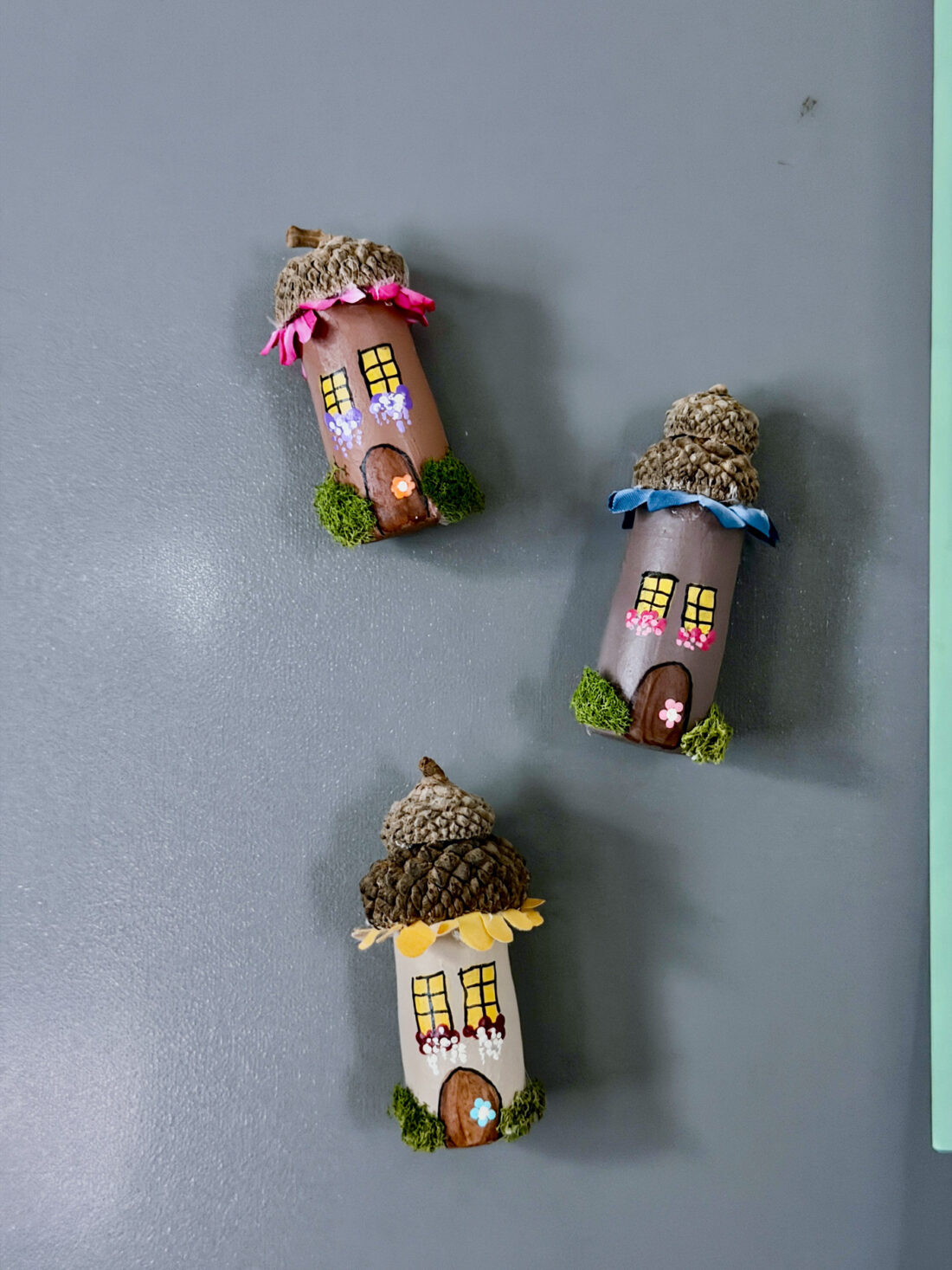 wine cork fairy house magnets on fridge